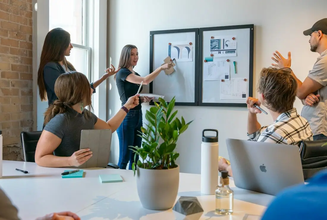 A workshop session at a whiteboard