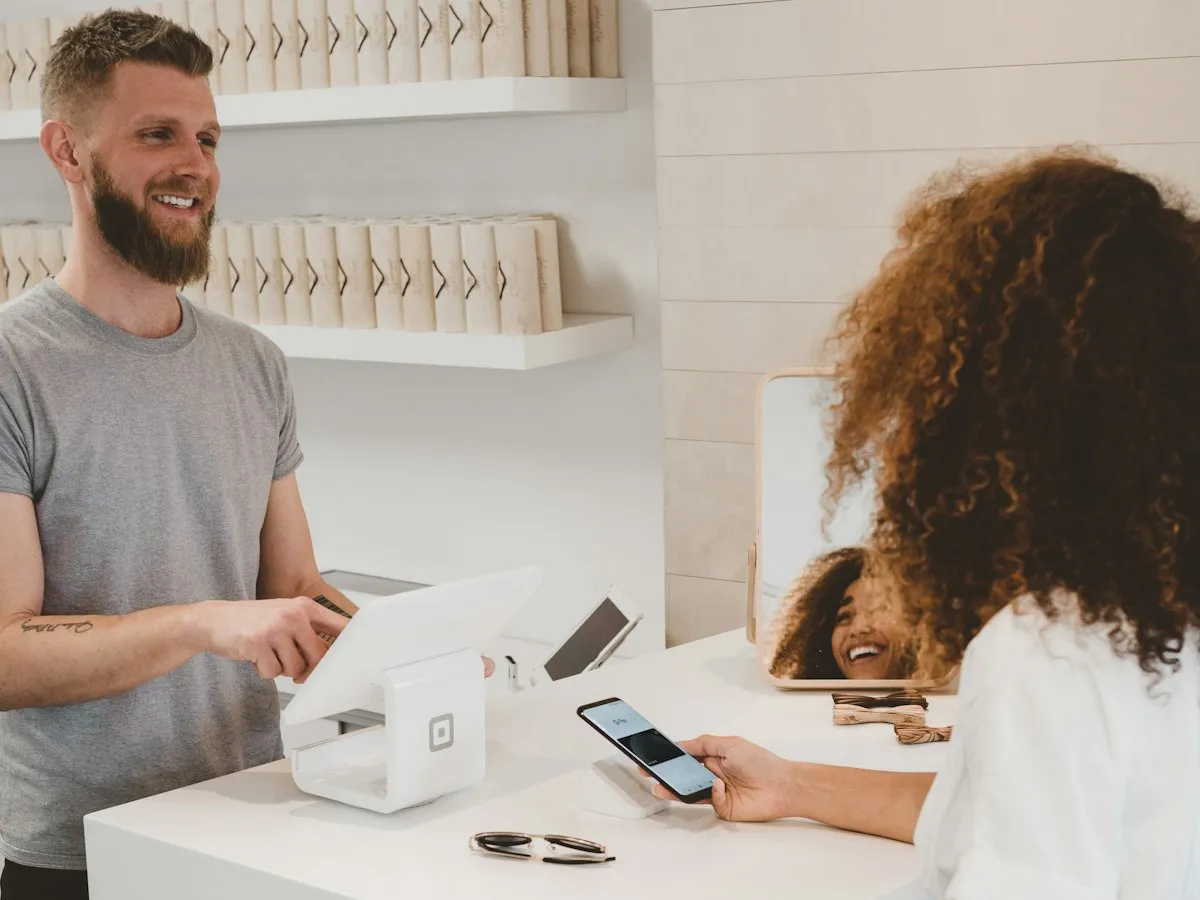 A customer making a payment at a retail checkout